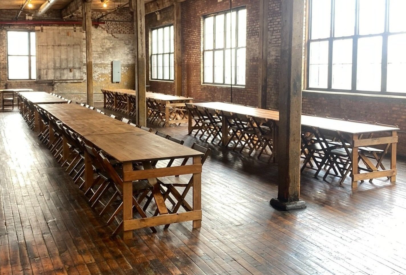 Vintage banquet tables in brick industrial setting